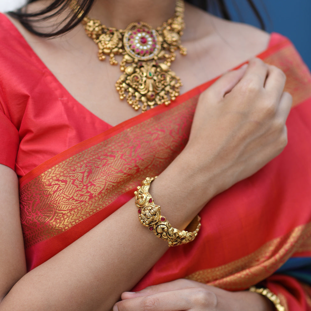 NAGAS BANGLE WITH PEACOCK AND LAKSHMI MOTIF.
