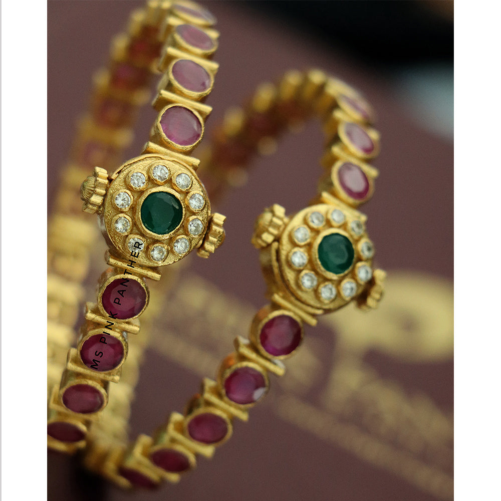 RUBY AND ZIRCONE SCREW BANGLE.