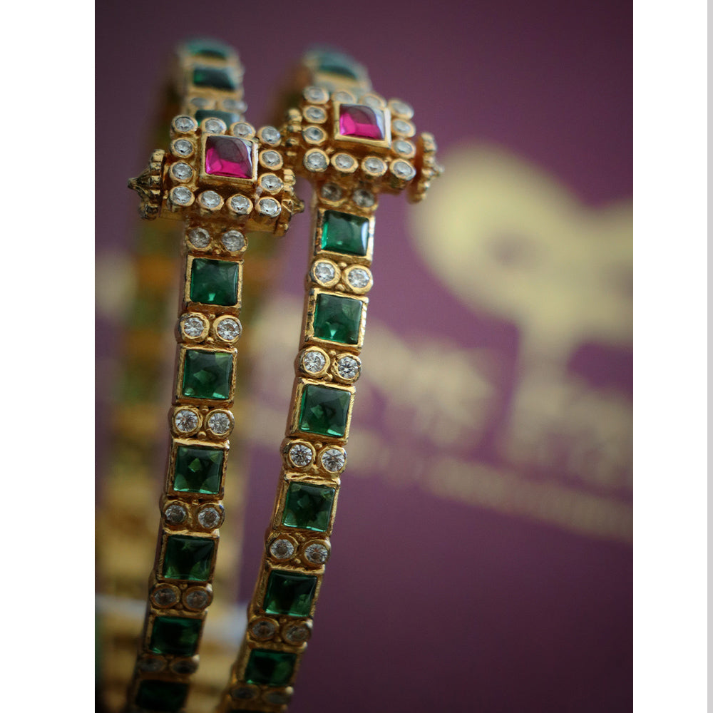 BANGLE WITH RUBY AND ZIRCON STONES.