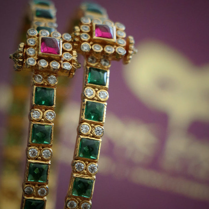 BANGLE WITH RUBY AND ZIRCON STONES.