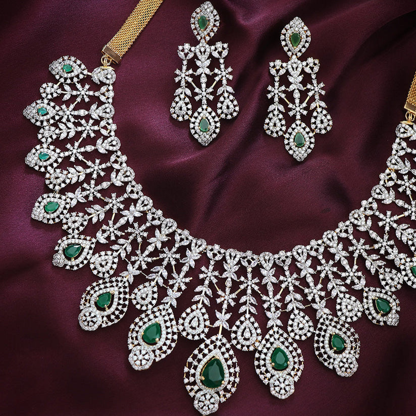 IMMITATION WHITE STONE SET WITH GREEN STONES.