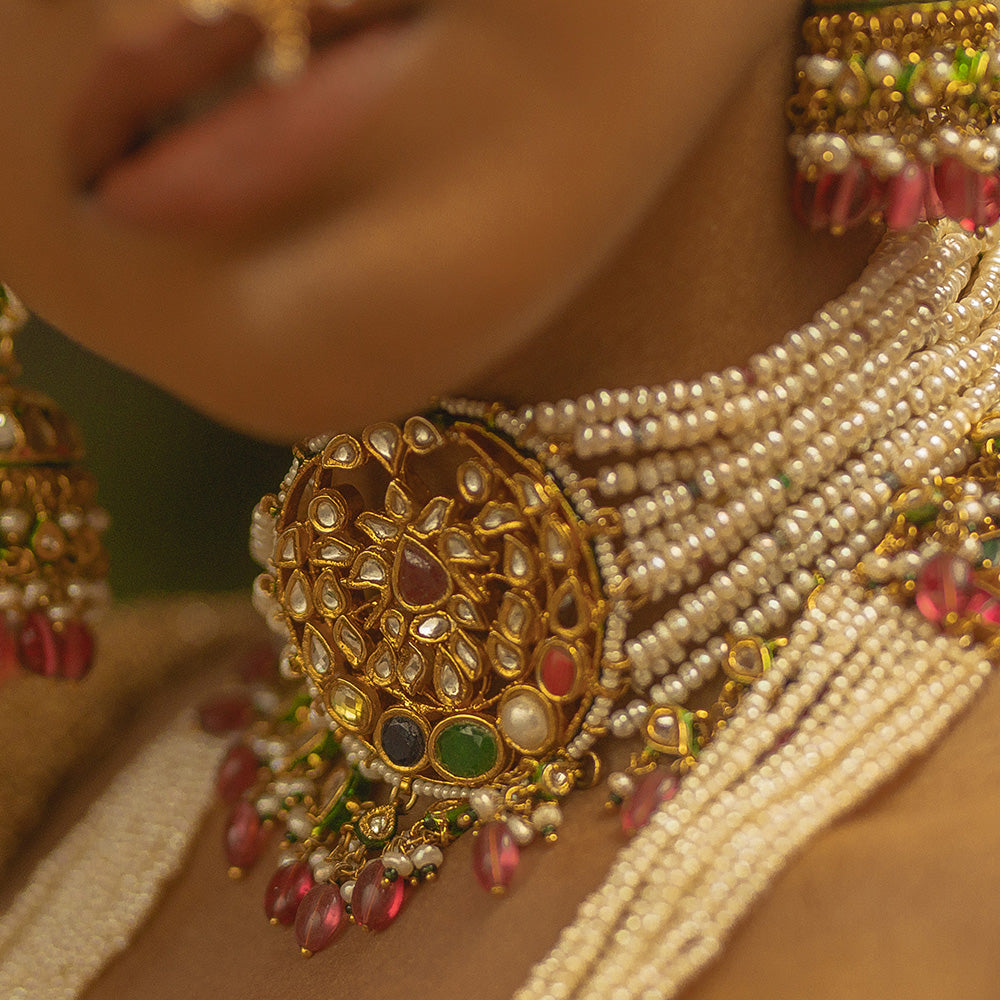 PEARL CHOKER WITH NAVARATHNA STONES AND RUBY BEAD HANGINGS.